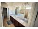 Bright bathroom featuring a double vanity with granite countertop, large mirrors and walk in closet at 333 Almansa St, Davenport, FL 33837