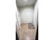 Entryway with ceramic tile flooring and gray mat in front of the closed door. White walls, door and trim at 333 Almansa St, Davenport, FL 33837