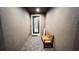 Cozy entryway featuring a patterned tile floor, a decorative front door, and a wooden bench for seating at 333 Almansa St, Davenport, FL 33837