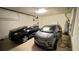 Well-lit garage featuring ample space for two cars, with additional storage solutions at 333 Almansa St, Davenport, FL 33837
