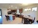 Spacious kitchen with granite countertops, stainless steel appliances, and an adjacent dining area at 333 Almansa St, Davenport, FL 33837
