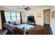 Comfortable living room with a leather sofa, a large window, and stylish decor at 333 Almansa St, Davenport, FL 33837