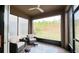 Screened patio with comfortable seating, offering views of the landscaped backyard at 333 Almansa St, Davenport, FL 33837