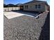 Spacious backyard featuring stone accents, gravel ground cover, and a high privacy fence at 377 Holly Berry Dr, Davenport, FL 33897