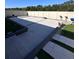 Backyard area with pavers, a retaining wall, and a new fence at 377 Holly Berry Dr, Davenport, FL 33897