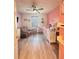 Spacious bedroom featuring a rocking chair, changing table, and crib on a light colored, wood-look floor at 377 Holly Berry Dr, Davenport, FL 33897