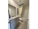 Cozy bathroom featuring granite countertop, modern vanity, shower, and tiled floors at 4247 Shackelford Ct, Orlando, FL 32824