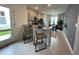 Eat-in kitchen with granite countertops, stainless appliances, tile floors, and view to dining area at 4247 Shackelford Ct, Orlando, FL 32824