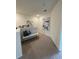 Upstairs loft area with neutral carpet, bench seating, and decorative artwork at 4247 Shackelford Ct, Orlando, FL 32824