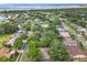 Aerial view showcasing the community's mature trees, scenic streets, and proximity to waterfront at 4907 Raylene Way, St Cloud, FL 34771
