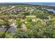 Beautiful aerial view of the neighborhood showcasing lush greenery, lake access, and convenient highway proximity at 4907 Raylene Way, St Cloud, FL 34771