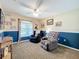 Comfortable bedroom featuring two-tone paint, a ceiling fan, a window and comfortable seating at 4907 Raylene Way, St Cloud, FL 34771