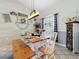 Bright dining area featuring modern lighting, a wooden table with bench seating, and stylish accents at 4907 Raylene Way, St Cloud, FL 34771