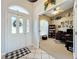 Inviting home office with a view of the entry, featuring classic decor and a comfortable workspace at 4907 Raylene Way, St Cloud, FL 34771