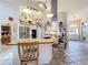Open layout of a kitchen featuring an island with seating and modern stainless appliances at 4907 Raylene Way, St Cloud, FL 34771