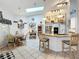 Bright kitchen with island seating, stainless steel appliances, and tiled floors at 4907 Raylene Way, St Cloud, FL 34771