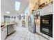 Eat-in kitchen featuring tile floors, stainless appliances, breakfast area and a skylight at 4907 Raylene Way, St Cloud, FL 34771