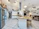 Bright kitchen featuring tile floors, granite counters, island and stainless steel appliances at 4907 Raylene Way, St Cloud, FL 34771