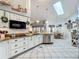 Bright kitchen featuring white cabinets, granite counters, subway tile backsplash and stainless appliances at 4907 Raylene Way, St Cloud, FL 34771