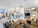 Open-concept living room with a seamless view into the kitchen area at 4907 Raylene Way, St Cloud, FL 34771