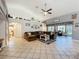 Spacious living room features a large sectional, and adjacent view to a bathroom at 4907 Raylene Way, St Cloud, FL 34771