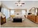 Spacious main bedroom featuring carpet, white trim, and coordinating furniture at 4907 Raylene Way, St Cloud, FL 34771