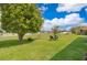 Expansive backyard with lush greenery and peaceful lake views at 4910 Culdesac Ct St, St Cloud, FL 34772