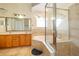Bright bathroom featuring double sinks, soaking tub and glass shower enclosure at 4910 Culdesac Ct St, St Cloud, FL 34772