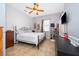 Bedroom with ceiling fan, dresser, and TV at 4910 Culdesac Ct St, St Cloud, FL 34772