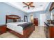 Spacious bedroom featuring a ceiling fan and wooden furniture set at 4910 Culdesac Ct St, St Cloud, FL 34772