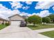 Charming single-story home with well-manicured lawn and a two-car garage at 4910 Culdesac Ct St, St Cloud, FL 34772