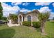 Charming home featuring a stone accent facade, well-manicured lawn, and lush landscaping at 4910 Culdesac Ct St, St Cloud, FL 34772