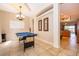 The game room flows into the kitchen with tile flooring throughout the house at 4910 Culdesac Ct St, St Cloud, FL 34772