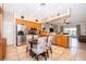 Eat-in kitchen with stainless steel appliances, wooden cabinetry, and plenty of counter space at 4910 Culdesac Ct St, St Cloud, FL 34772