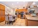 Spacious eat-in kitchen with tiled floors, stainless appliances, and wooden cabinets at 4910 Culdesac Ct St, St Cloud, FL 34772