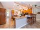 Open-concept kitchen featuring a center island with seating and stainless steel appliances at 4910 Culdesac Ct St, St Cloud, FL 34772
