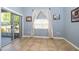 This sunroom features tile floors, a window with curtains, and sliding glass doors to the backyard at 4910 Culdesac Ct St, St Cloud, FL 34772
