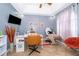 Bright room featuring massage table, desk and ceiling fan at 4910 Culdesac Ct St, St Cloud, FL 34772
