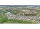 Beautiful aerial view of the homes and lake, surrounded by lush trees and landscaping in a suburban neighborhood at 5316 Burning Tree Dr # A09-2, Orlando, FL 32811