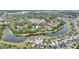 Scenic aerial view of the homes next to the lake, with lush trees, community pool, and serene neighborhood setting at 5316 Burning Tree Dr # A09-2, Orlando, FL 32811