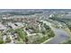 Breathtaking aerial view of lakeside homes, lush greenery, and serene community nestled in a tranquil neighborhood at 5316 Burning Tree Dr # A09-2, Orlando, FL 32811