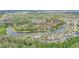 Aerial view of community, trees, and lake at 5316 Burning Tree Dr # A09-2, Orlando, FL 32811