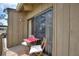 Balcony with a small table and chairs at 5316 Burning Tree Dr # A09-2, Orlando, FL 32811