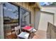 Balcony with chairs and a view of the tennis courts at 5316 Burning Tree Dr # A09-2, Orlando, FL 32811