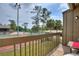 Condo balcony with a view of trees and a tennis court at 5316 Burning Tree Dr # A09-2, Orlando, FL 32811