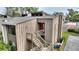 Inviting multi-level townhome with exterior staircase and a red door at 5316 Burning Tree Dr # A09-2, Orlando, FL 32811