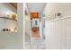 Welcoming hallway with tiled floors, coat hooks, and view into the naturally lit living area at 5316 Burning Tree Dr # A09-2, Orlando, FL 32811