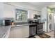 Well-appointed kitchen featuring stainless steel appliances and durable granite countertops at 5316 Burning Tree Dr # A09-2, Orlando, FL 32811