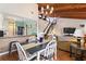 Spacious open-concept living room featuring a dining area, stairs to loft and a wooden ceiling at 5316 Burning Tree Dr # A09-2, Orlando, FL 32811