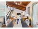 Open-concept living space featuring a wooden ceiling, staircase, and dining area with lots of natural light at 5316 Burning Tree Dr # A09-2, Orlando, FL 32811